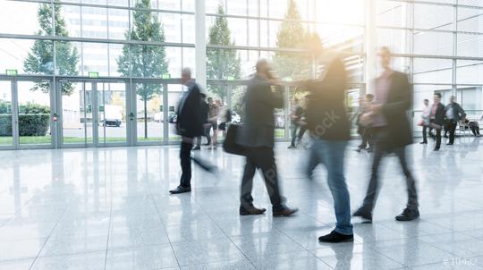 Blurred business people walking at a trade fair  : Stock Photo or Stock Video Download rcfotostock photos, images and assets rcfotostock | RC Photo Stock.: