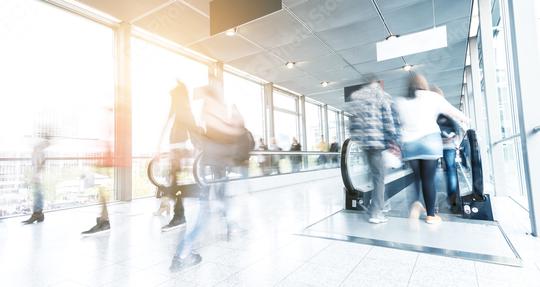 blurred commuters walking at a airport entrance   : Stock Photo or Stock Video Download rcfotostock photos, images and assets rcfotostock | RC Photo Stock.: