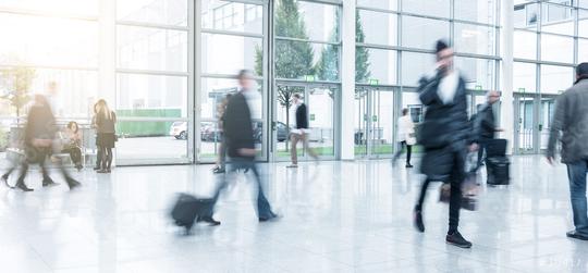 blurred commuters walking at a trade fair  : Stock Photo or Stock Video Download rcfotostock photos, images and assets rcfotostock | RC Photo Stock.: