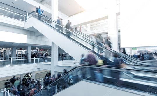 Blurred people using a escalator on a International Trade Fair  : Stock Photo or Stock Video Download rcfotostock photos, images and assets rcfotostock | RC Photo Stock.: