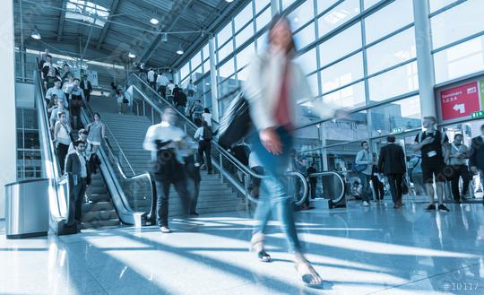 Blurred trade fair visitor using a skywalk/staircase  : Stock Photo or Stock Video Download rcfotostock photos, images and assets rcfotostock | RC Photo Stock.:
