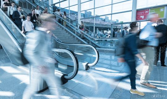 Blurred trade fair visitors using a escalator/stairs  : Stock Photo or Stock Video Download rcfotostock photos, images and assets rcfotostock | RC Photo Stock.: