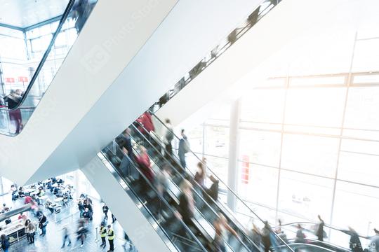 blurred traid fair crowd using a escalator  : Stock Photo or Stock Video Download rcfotostock photos, images and assets rcfotostock | RC Photo Stock.: