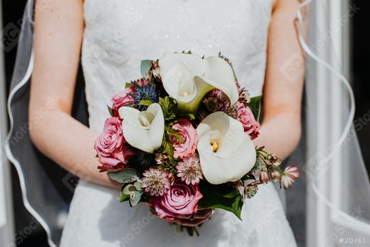 
Bride is holding with her hands a wedding bouquet of flowers on her wedding day. Close-up of the beautiful natural flowers.   : Stock Photo or Stock Video Download rcfotostock photos, images and assets rcfotostock | RC Photo Stock.: