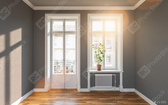 Bright old building with gray walls and a balcony door next to the window with bright sunlight  : Stock Photo or Stock Video Download rcfotostock photos, images and assets rcfotostock | RC Photo Stock.: