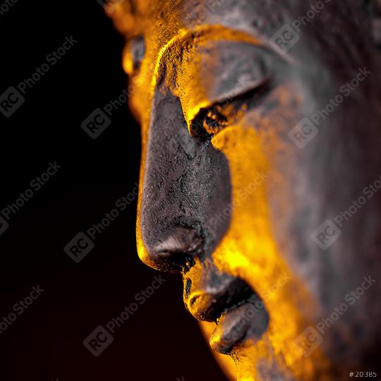 Buddha statue head close-up with glow against black background  : Stock Photo or Stock Video Download rcfotostock photos, images and assets rcfotostock | RC-Photo-Stock.: