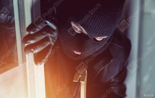 Burglar entering a house window with a crowbar  : Stock Photo or Stock Video Download rcfotostock photos, images and assets rcfotostock | RC Photo Stock.: