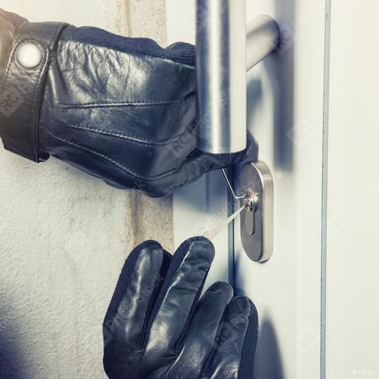 burglar holding Lock picker to open a door  : Stock Photo or Stock Video Download rcfotostock photos, images and assets rcfotostock | RC Photo Stock.:
