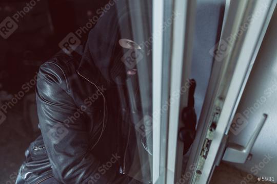 Burglar looking to a open window of a house at night  : Stock Photo or Stock Video Download rcfotostock photos, images and assets rcfotostock | RC Photo Stock.: