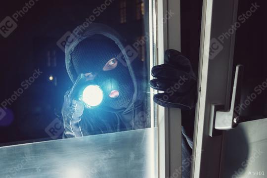 Burglar shines with flashlight in to a house at night  : Stock Photo or Stock Video Download rcfotostock photos, images and assets rcfotostock | RC Photo Stock.: