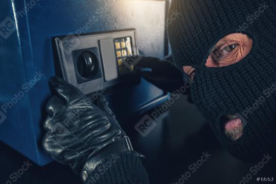 Burglar tries to find the combination code of a safe   : Stock Photo or Stock Video Download rcfotostock photos, images and assets rcfotostock | RC Photo Stock.: