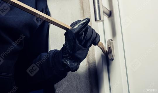burglar using crowbar to break a home door at night  : Stock Photo or Stock Video Download rcfotostock photos, images and assets rcfotostock | RC Photo Stock.:
