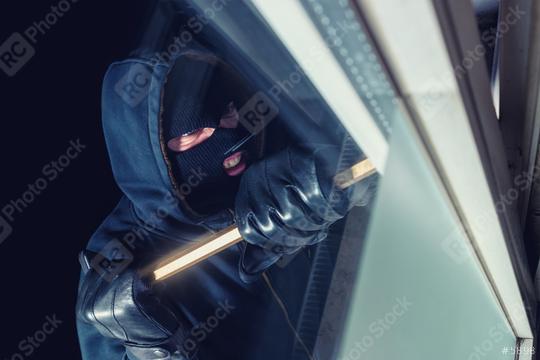 burglar using crowbar to break into a house window at night   : Stock Photo or Stock Video Download rcfotostock photos, images and assets rcfotostock | RC Photo Stock.:
