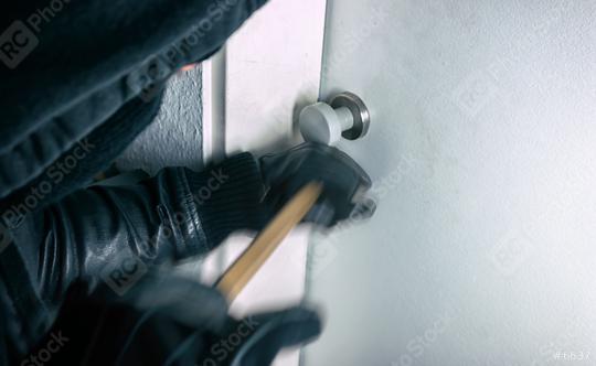 burglar with crowbar opens a house door at night  : Stock Photo or Stock Video Download rcfotostock photos, images and assets rcfotostock | RC Photo Stock.: