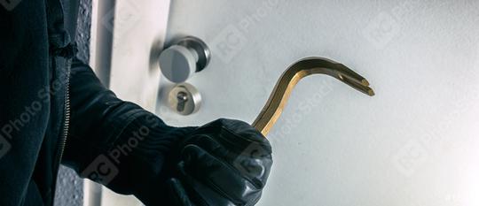burglar with crowbar trying to bopens a house door   : Stock Photo or Stock Video Download rcfotostock photos, images and assets rcfotostock | RC Photo Stock.: