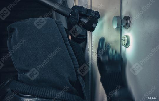 Burglar with lock picking tools breaking into a house door  : Stock Photo or Stock Video Download rcfotostock photos, images and assets rcfotostock | RC Photo Stock.: