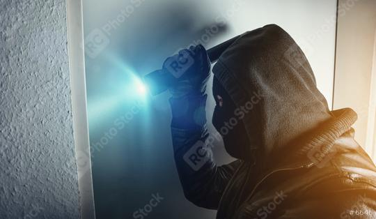 burglar with torch breaking and entering house door at night  : Stock Photo or Stock Video Download rcfotostock photos, images and assets rcfotostock | RC Photo Stock.: