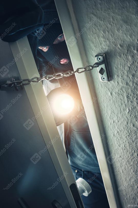 burglar with torch entering into a door at night  : Stock Photo or Stock Video Download rcfotostock photos, images and assets rcfotostock | RC Photo Stock.: