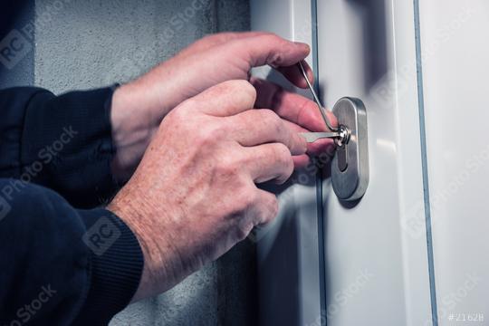 Burglars crack the front door with lock picking  : Stock Photo or Stock Video Download rcfotostock photos, images and assets rcfotostock | RC Photo Stock.: