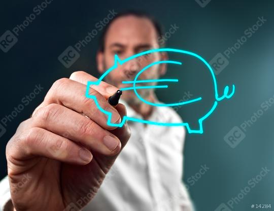 Business man draws a piggy bank  : Stock Photo or Stock Video Download rcfotostock photos, images and assets rcfotostock | RC Photo Stock.: