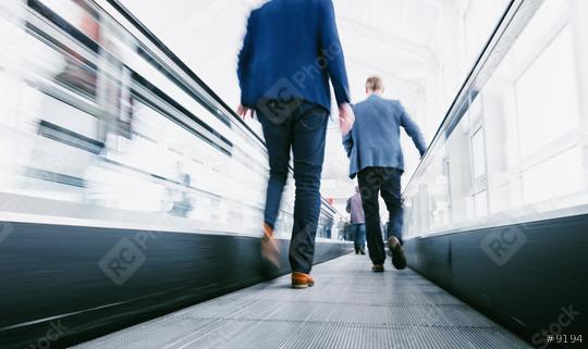 business people using a escalator on a  trade show  : Stock Photo or Stock Video Download rcfotostock photos, images and assets rcfotostock | RC Photo Stock.: