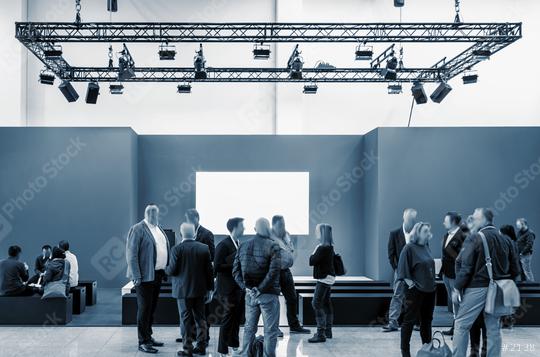 business people walking between trade show booths at a public event exhibition hall and copy space for individual text   : Stock Photo or Stock Video Download rcfotostock photos, images and assets rcfotostock | RC Photo Stock.: