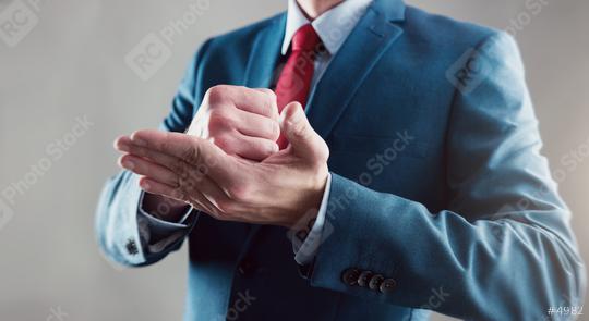 businessman celebrating success clenched fist on his hand  : Stock Photo or Stock Video Download rcfotostock photos, images and assets rcfotostock | RC Photo Stock.: