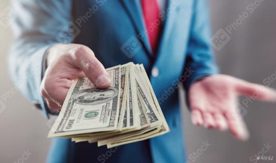 Businessman displaying a Spread of Cash  : Stock Photo or Stock Video Download rcfotostock photos, images and assets rcfotostock | RC Photo Stock.: