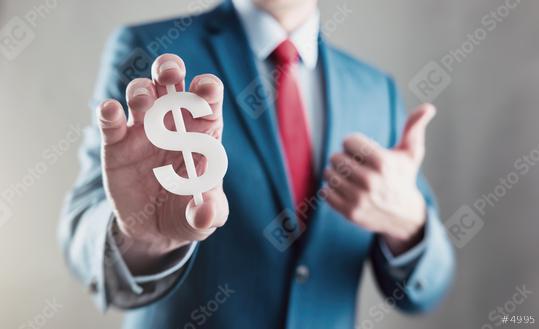 Businessman holding a dollar sign and thumb up  : Stock Photo or Stock Video Download rcfotostock photos, images and assets rcfotostock | RC Photo Stock.: