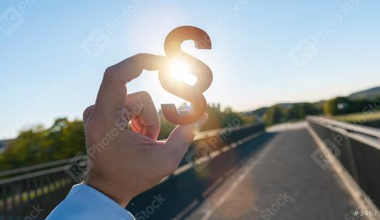 Businessman holds paragraph in to the sun  : Stock Photo or Stock Video Download rcfotostock photos, images and assets rcfotostock | RC Photo Stock.: