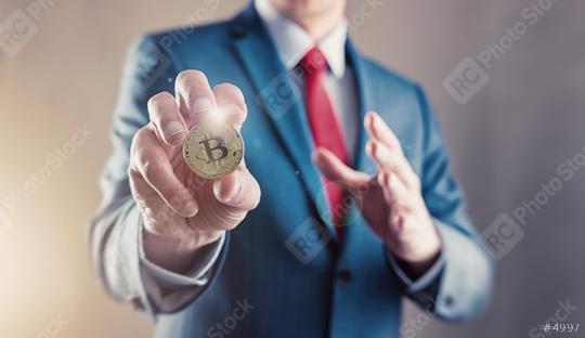 Businessman offers bitcoin - bit coin BTC the new virtual money  : Stock Photo or Stock Video Download rcfotostock photos, images and assets rcfotostock | RC Photo Stock.: