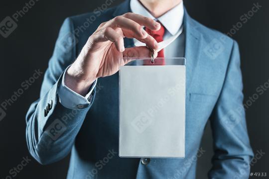 Businessman showing a blank security identity name card on a lanyard  : Stock Photo or Stock Video Download rcfotostock photos, images and assets rcfotostock | RC Photo Stock.: