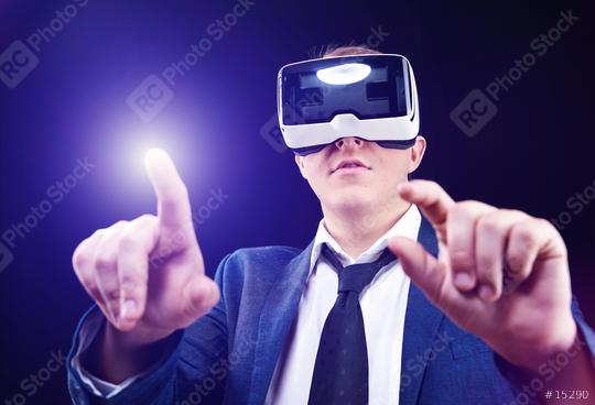 Businessman uses Virtual Realitiy VR head-mounted display  : Stock Photo or Stock Video Download rcfotostock photos, images and assets rcfotostock | RC-Photo-Stock.: