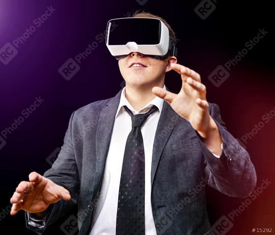 Businessman uses Virtual Realitiy VR head-mounted display  : Stock Photo or Stock Video Download rcfotostock photos, images and assets rcfotostock | RC Photo Stock.: