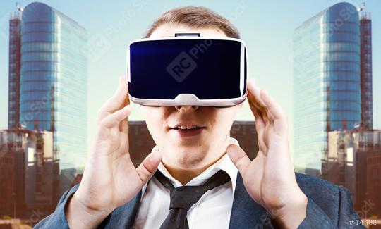Businessman uses Virtual Reality VR head mounted display  : Stock Photo or Stock Video Download rcfotostock photos, images and assets rcfotostock | RC Photo Stock.: