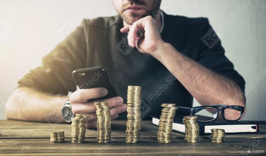 Calculating Finance with smartphone  : Stock Photo or Stock Video Download rcfotostock photos, images and assets rcfotostock | RC Photo Stock.: