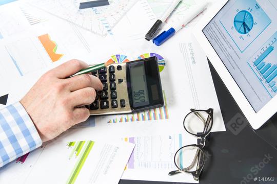 Calculating with business documents  : Stock Photo or Stock Video Download rcfotostock photos, images and assets rcfotostock | RC Photo Stock.: