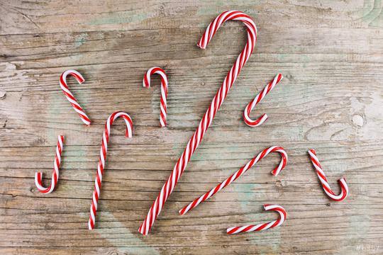 candy cane striped in Christmas colours on wooden background  : Stock Photo or Stock Video Download rcfotostock photos, images and assets rcfotostock | RC Photo Stock.:
