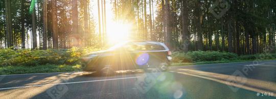 car drives Long a Forest Road In Alpine Mountains at sunset  : Stock Photo or Stock Video Download rcfotostock photos, images and assets rcfotostock | RC Photo Stock.:
