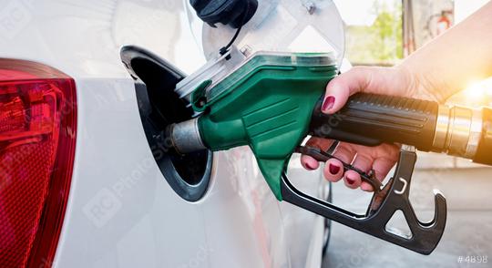 Car refueling on gas station. Woman pumping gasoline oil.  : Stock Photo or Stock Video Download rcfotostock photos, images and assets rcfotostock | RC Photo Stock.: