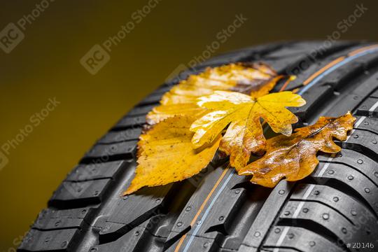 car tire with autumn leaves on brown background  : Stock Photo or Stock Video Download rcfotostock photos, images and assets rcfotostock | RC Photo Stock.: