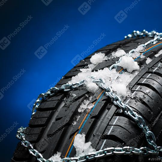 car tire with snow and snow chain  in winter on blue background  : Stock Photo or Stock Video Download rcfotostock photos, images and assets rcfotostock | RC Photo Stock.: