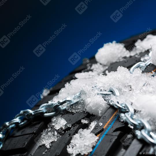 Car tire with snow chains and ice on blue background  : Stock Photo or Stock Video Download rcfotostock photos, images and assets rcfotostock | RC Photo Stock.:
