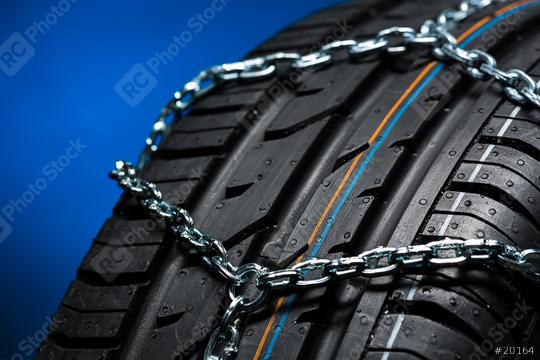 Car tyre with snow chain in the winter   : Stock Photo or Stock Video Download rcfotostock photos, images and assets rcfotostock | RC Photo Stock.: