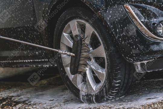 Car washing with soap and brush. Wheel aloy cleaning at car wash station  : Stock Photo or Stock Video Download rcfotostock photos, images and assets rcfotostock | RC Photo Stock.: