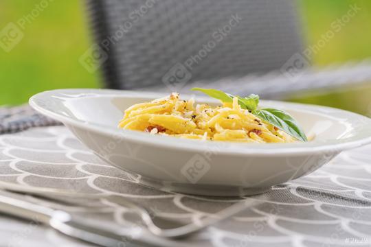 Carbonara pasta, spaghetti with pancetta, egg, hard parmesan cheese and cream sauce. on a table outside  : Stock Photo or Stock Video Download rcfotostock photos, images and assets rcfotostock | RC Photo Stock.: