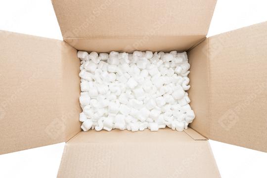cardboard box with packing foam pellets top view, isolated on