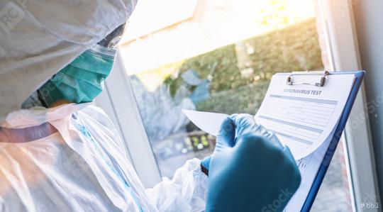 caregiver fills out a coronavirus test data sheet with pen in protective clothing in a clinic at Covid-19 coronavirus epidemic  : Stock Photo or Stock Video Download rcfotostock photos, images and assets rcfotostock | RC Photo Stock.:
