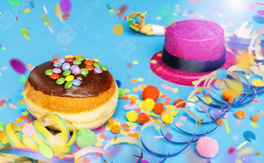 Carnival donut from Germany with icing chocolate sugar on a blue surface with confetti and streamers on it - background for a carnival party or parties  : Stock Photo or Stock Video Download rcfotostock photos, images and assets rcfotostock | RC Photo Stock.: