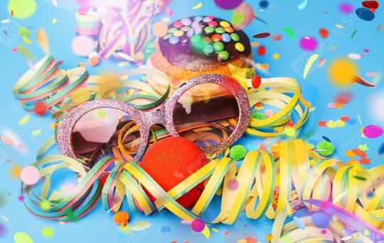 Carnival sunglasses with donut from Germany with icing chocolate sugar on a blue surface with confetti and streamers on it - background for a carnival party or parties  : Stock Photo or Stock Video Download rcfotostock photos, images and assets rcfotostock | RC Photo Stock.: